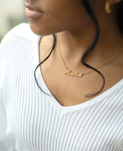 Load image into Gallery viewer, Person wearing a gold necklace that reads Houston
