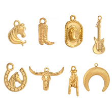 Load image into Gallery viewer, Set of gold charms including horse head, cowboy boot, cowboy hat, guitar, and more on a white background
